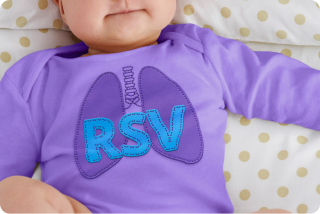 Shirt with “RSV” on an infant